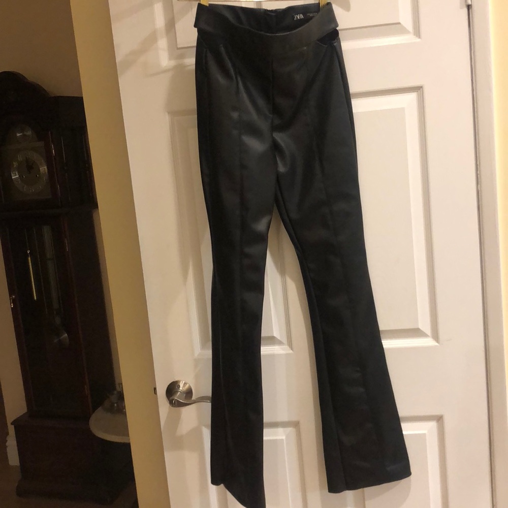 leather pants with hole showing design on the two side of the waist. Almost new